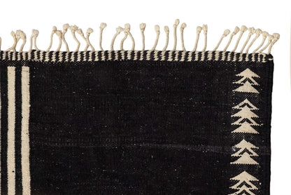 Char Noir – Black & Ivory Moroccan Rug featuring handwoven black and ivory geometric patterns.