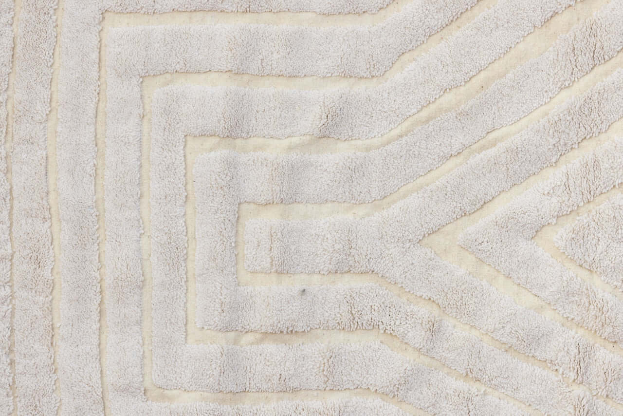Nomad Lines – Ivory Moroccan Rug close-up showcasing the sculpted linear patterns and soft ivory color.