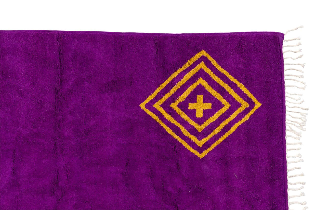 Sahara Gaze – Moroccan Rug with Golden Motifs featuring deep magenta and golden motifs, showcasing elegant craftsmanship.