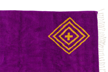 Sahara Gaze – Moroccan Rug with Golden Motifs featuring deep magenta and golden motifs, showcasing elegant craftsmanship.